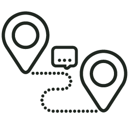 Two map location pins connected by a dotted line, with a speech bubble in between them.